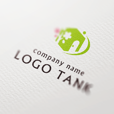 建物と桜の木をイメージしたロゴ