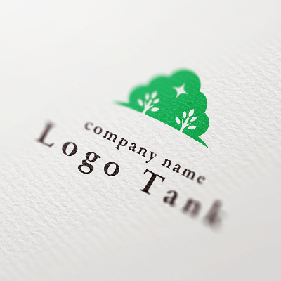 森の木々と丘の上、輝きをイメージしたロゴ